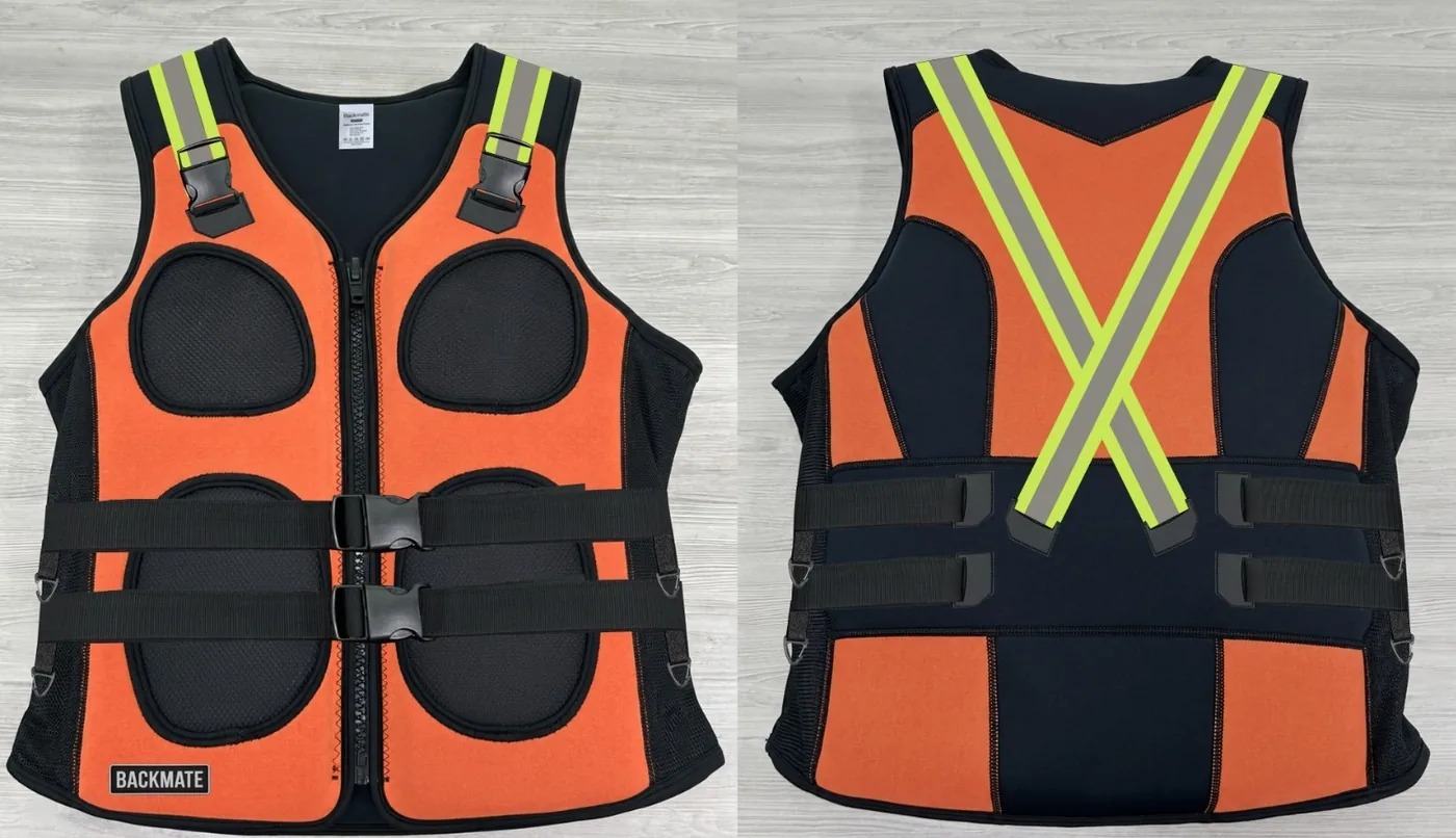 The Backmate prototype in hi-vis orange, photographed front and back, showing the chest zip, the twin lumbar belts and the reflective cross on the back